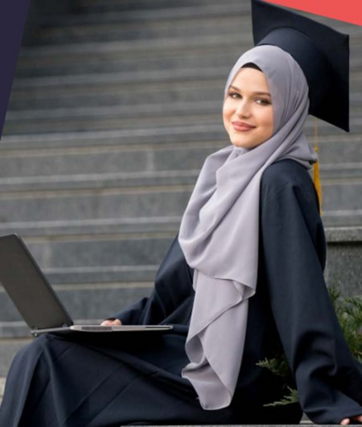 Muslim graduate with laptop